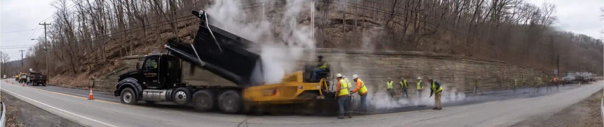 A Tri-Rivers tri-axle on a Mon Valley paving job